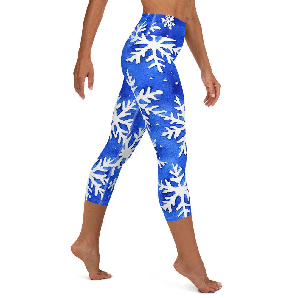Capri style leggings with white snowflakes on blue background